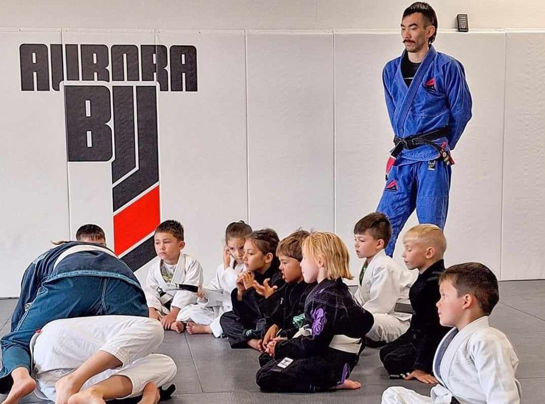 Professor Mike Gerlach with some of the Aurora BJJ kids class